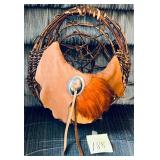 Handmade Native American style basket featuring..