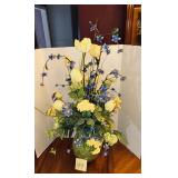 Decorative silk flower centerpiece featuring wh..