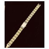 Gold-plated Seiko women's watch featuring a rec..