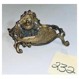 vintage brass inkwell set with an ornate scroll..