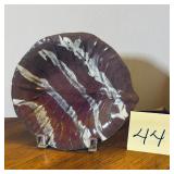 Vintage organic-style pottery dish featuring a ..