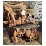 Metal sculpture of a rainbow trout mounted on l..