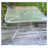 Square glass-top patio dining table with metal ..