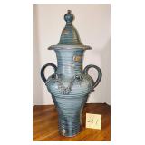 Handcrafted, lidded ceramic urn with textured b..