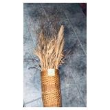 Vintage rattan basket used as a vase for a drie..