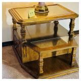 Vintage wood end table with a glass top and two..