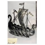 Vintage metal Viking longship sculpture featuri..