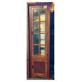 Brown oak corner curio cabinet with a glass-pan..