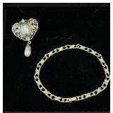 Victorian Style gold-tone filigree brooch & tex..