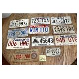 Mixed lot of 11 collectible license plates