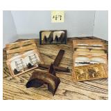 Vintage stereoscope viewer with accompanying st..