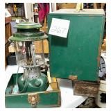 Vintage green metal carry case and a Coleman la..