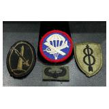 Assorted military patches featuring a World War..