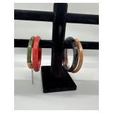 A Collection of Amber Black Red and Green Bangle B