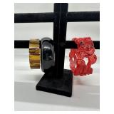 A Trio of Red Black and Tortoiseshell Patterned Ba