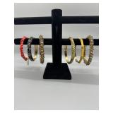 A Collection of Assorted Enamel and Stone Set Bang