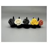 A Collection of Five Floral Resin Rings