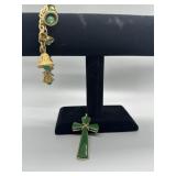 A Collection of Gold Tone and Green Jewelry