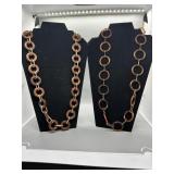 Two Necklaces with Amber Colored and Brown Circula