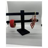 A Collection of Red and Gold Tone Jewelry