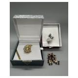 A Trio of Crystal and Stone Brooches and Pendants