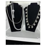 Several Silver-Toned Necklaces with Orb and Tassel