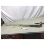 Fishing poles. One with reel.