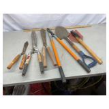 Yard tools. Pruner, hedge trimmers. Shovels.
