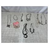 Costume jewelry necklaces, candle