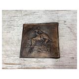 Copper look bas-relief bucking horse/cowboy