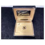 Tie tack, possibly tiger eye stone
