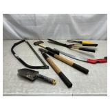 Pruners, saws, trowel, hatchet, clippers