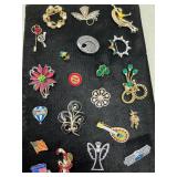 Assortment of brooches and pins