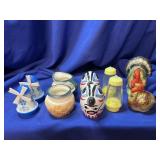 4 sets of Salt and Pepper Shakers and a creamer