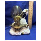 Vintage Enesco Genie holding an Aladdin style