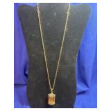 Estï¿½e Lauder solid perfume locket necklace
