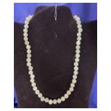 light green round bead necklace featuring smooth,