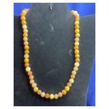 classic single-strand beaded necklace featuring