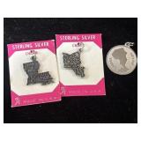 Three sterling silver charms