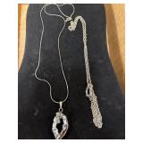 Two necklaces. Cut geode stone on one with a