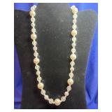 beaded necklace featuring alternating white round