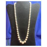classic white graduated bead necklace featuring