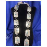 Southwest-style linked concho belt featuring