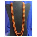 double-strand orange beaded necklace featuring