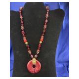 striking red and gold beaded statement necklace