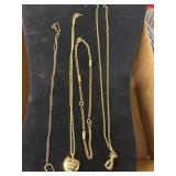 Four vintage gold toe necklaces