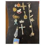Pendants, pins, bracelet.