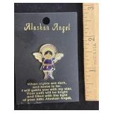 Alaskan Angel enamel lapel pin on its original