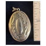 oval gold-tone engraved photo locket pendant with