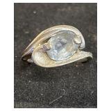 10K ring set with an oval cabochon gemstone